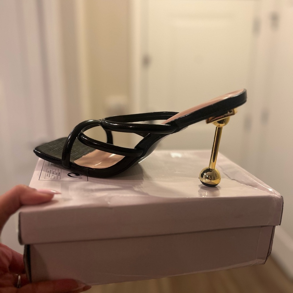 Black strapless gold heel
